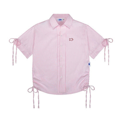 Pink checkered shirt with fish embroidery on a white background