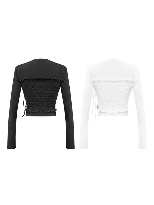 Black and white long-sleeve crop tops on a white background