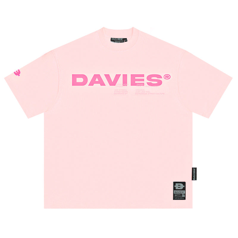 Pink t-shirt with 'DAVIES' logo on a white background