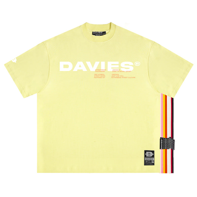 Yellow t-shirt with 'DAVIES' branding and colorful stripes on a white background