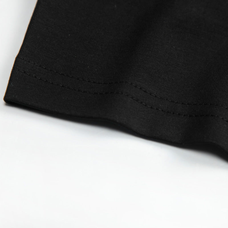 Close-up of a black fabric edge on a white background