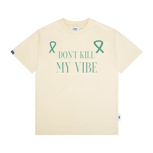 Beige t-shirt with teal ribbons and text 'Don't Kill My Vibe' on a white background