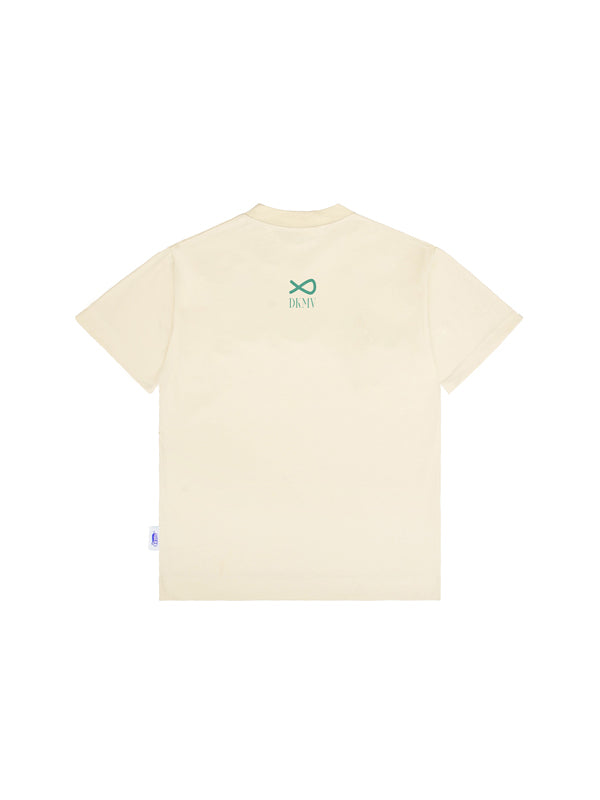 Beige t-shirt with a green logo on the back against a white background