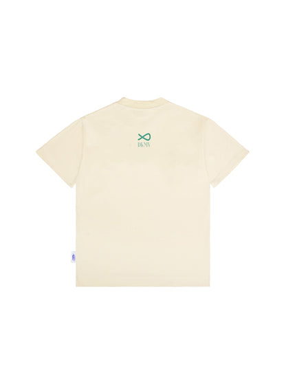 Beige t-shirt with a green logo on the back against a white background