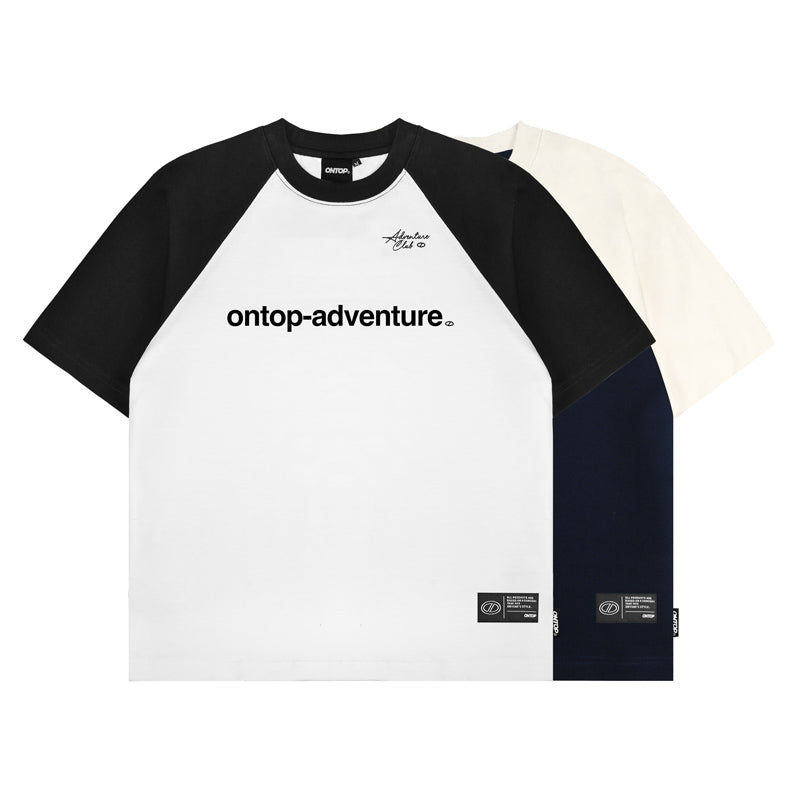 Black and white baseball-style shirt with 'ontop-adventure' logo on a white background