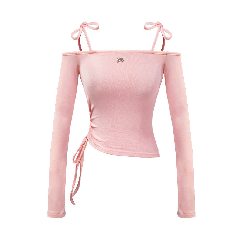 Pink long-sleeve top with thin straps on a white background