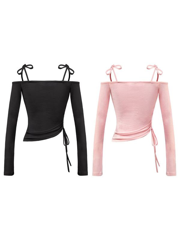 Black and pink long-sleeve tops with tie straps on a white background