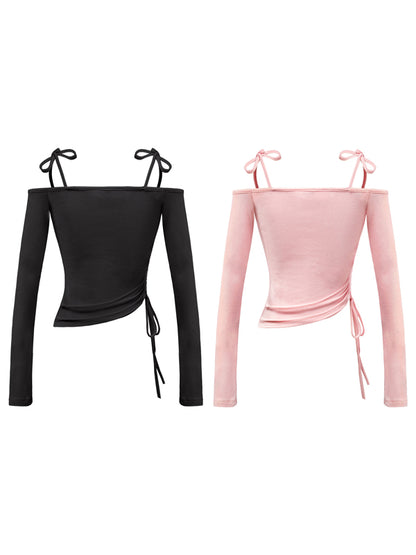 Black and pink long-sleeve tops with tie straps on a white background