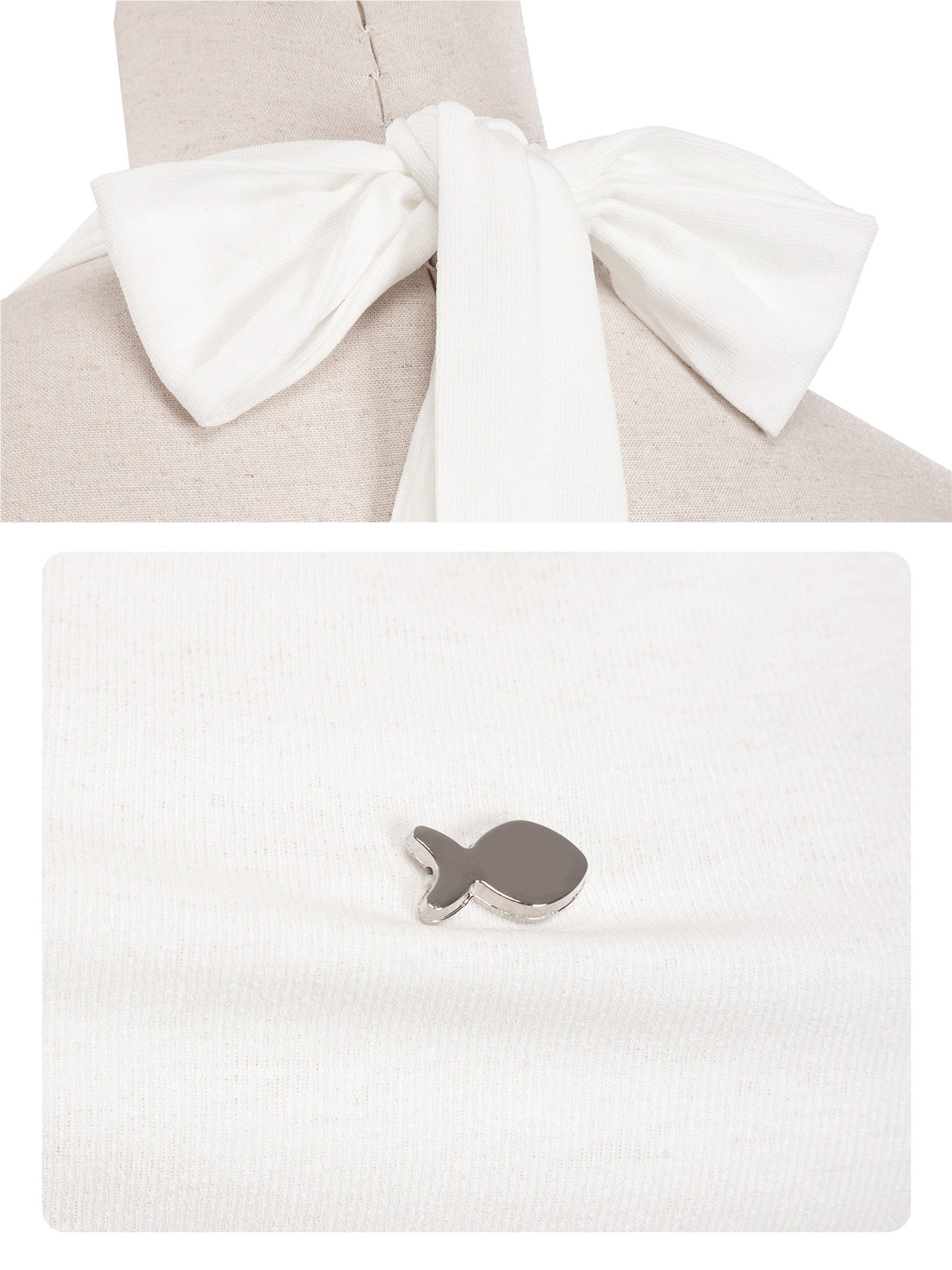 White shirt with a bow tie and a small fish-shaped accessory on a white background