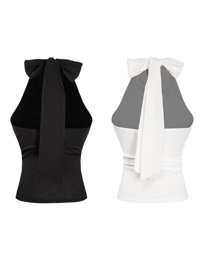 Black and white halter tops with bow details on a white background