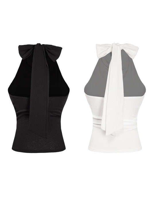 Black and white halter tops with bow details on a white background
