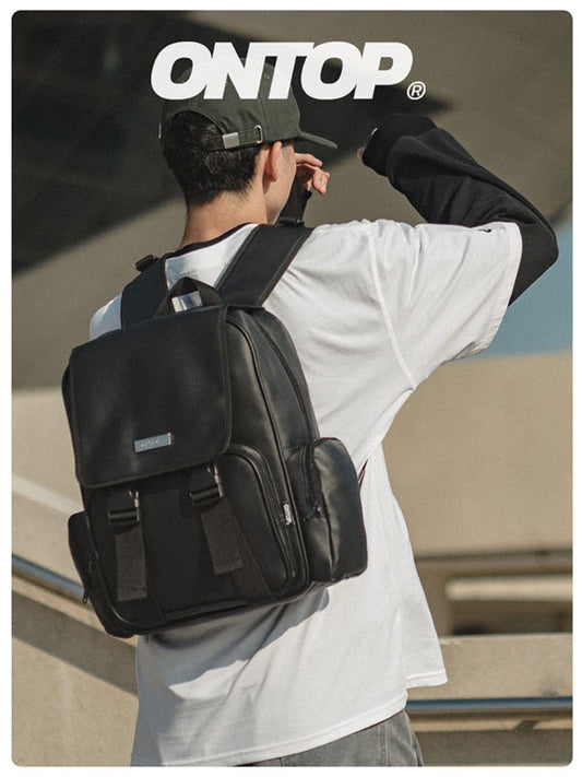 Person wearing a black backpack with 'ONTOP' branding in the background