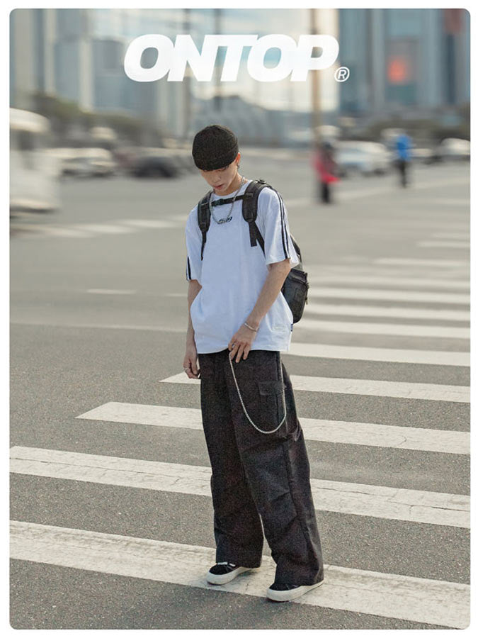 Person standing on a crosswalk with 'ONTOP' branding in the background
