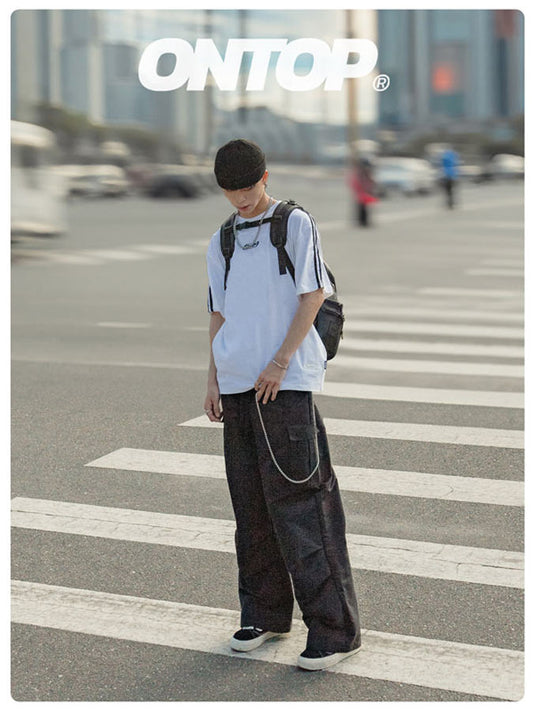 Person standing on a crosswalk with 'ONTOP' branding in the background