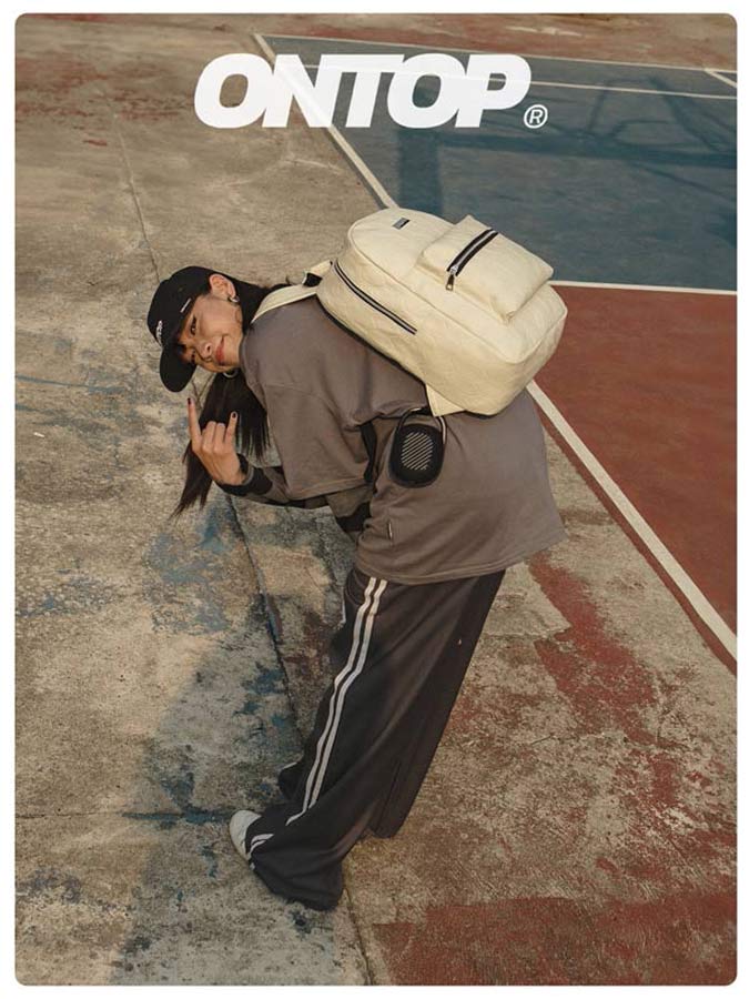 Person with a large backpack on a court, with 'ONTOP' branding.