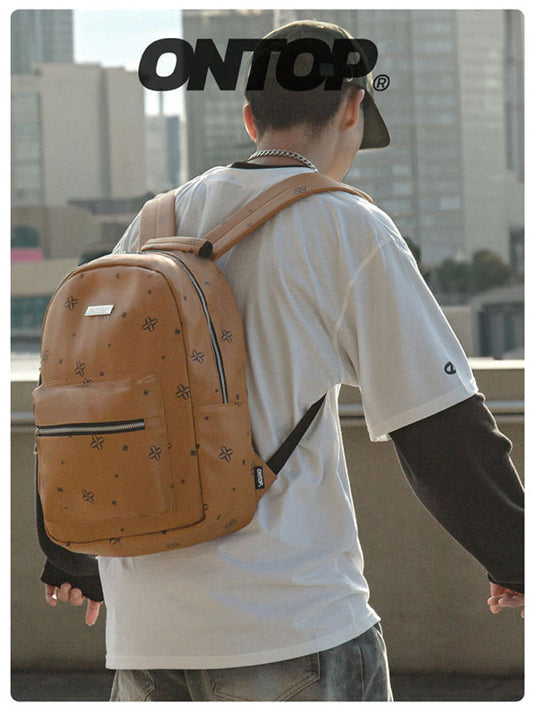 Person wearing a tan backpack with a cityscape background, featuring the brand 'ONTOP'.