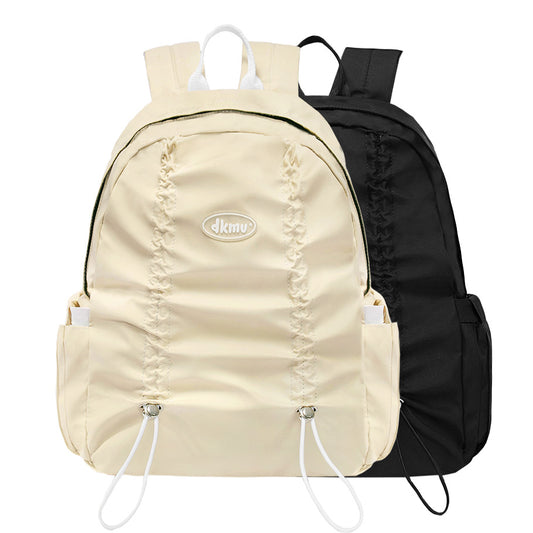 Beige and black drawstring bags with 'dkny' logo on a white background