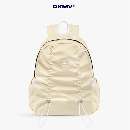Beige backpack with 'DKMV' logo on a white background