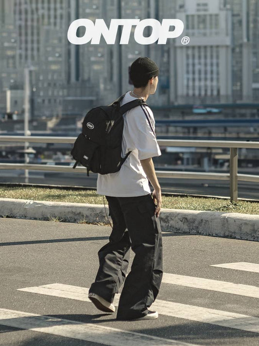 Person walking on a zebra crossing with 'ONTOP' logo in the background