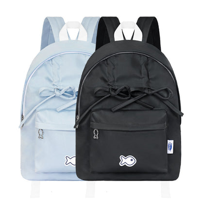 Two backpacks, one black and one light blue, with fish designs on a white background.
