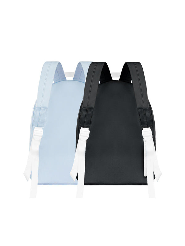 Two backpacks, one black and one light blue, on a white background