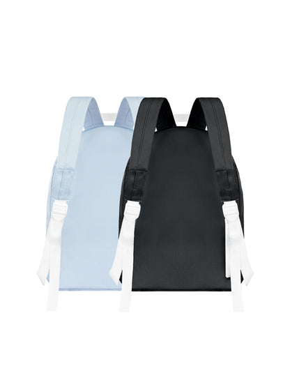 Two backpacks, one black and one light blue, on a white background