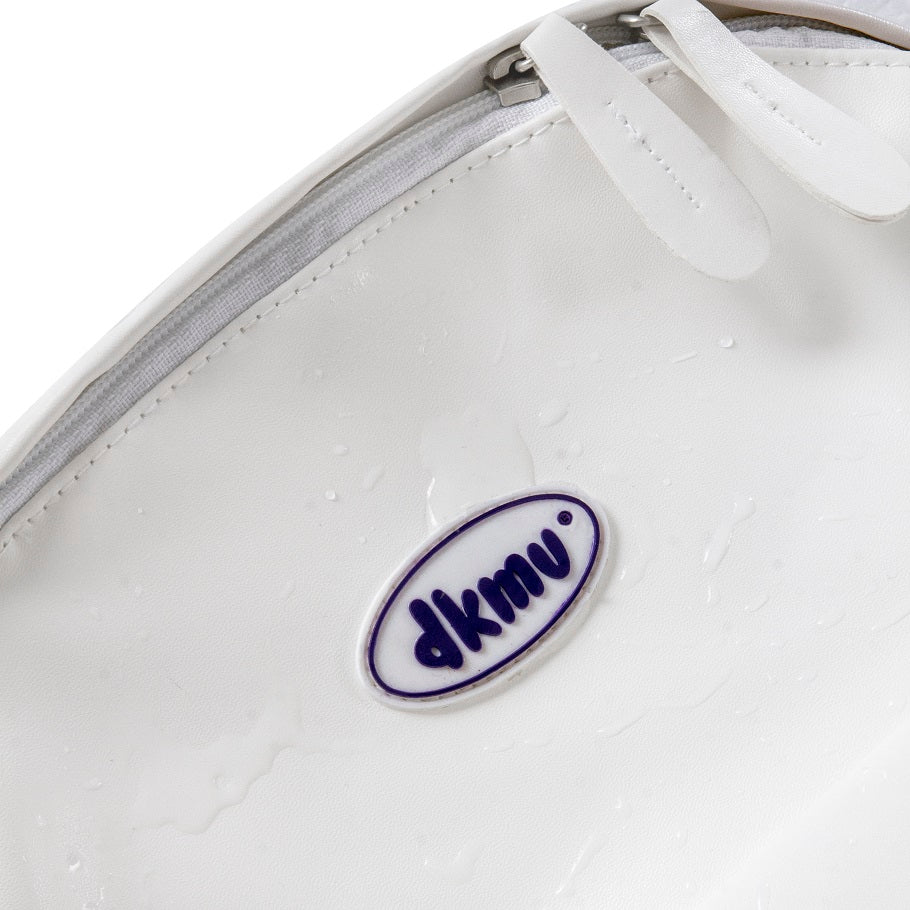 Close-up of a white shoe with a blue and white logo on a white background