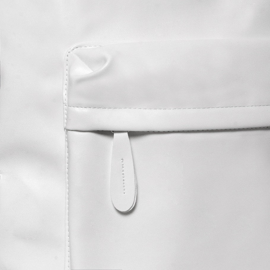 Close-up of a white leather bag with a strap on a light gray background