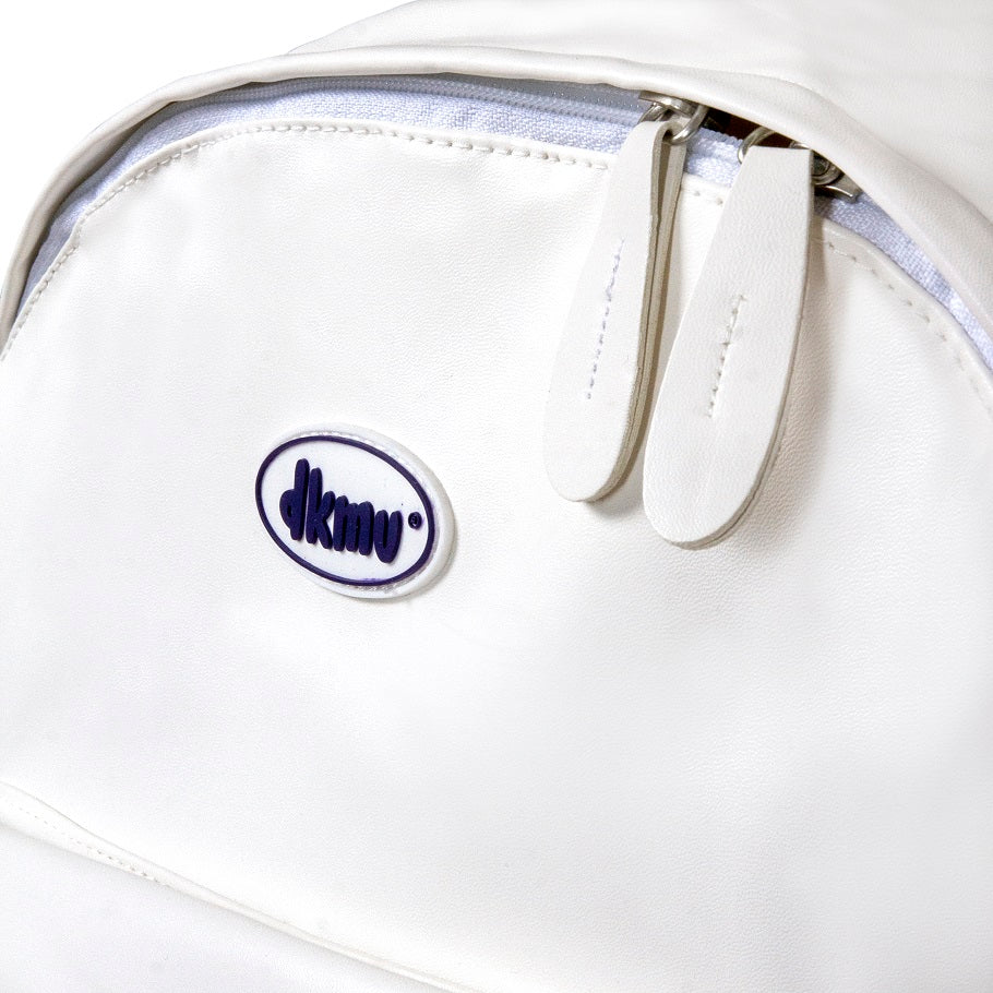 Close-up of a white bag with a visible brand logo on a white background