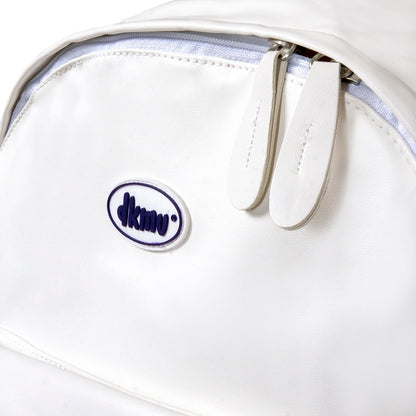 Close-up of a white bag with a visible brand logo on a white background