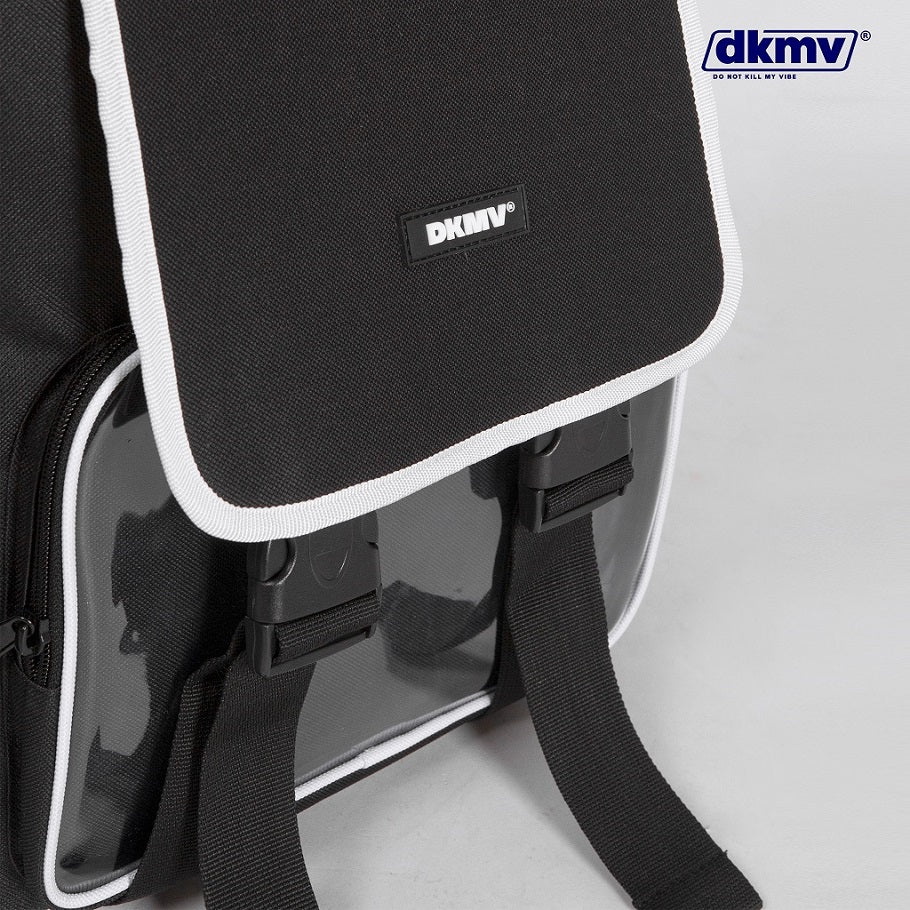 Black backpack with white trim and DKMV logo on a light gray background