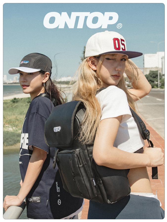 Two people wearing black backpacks with 'ONTOP' branding, standing outdoors.