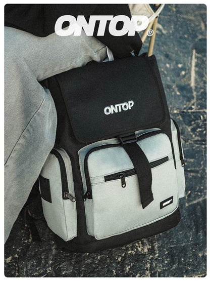 Backpack with black top pack and white side packs, featuring 'ONTOP' branding.
