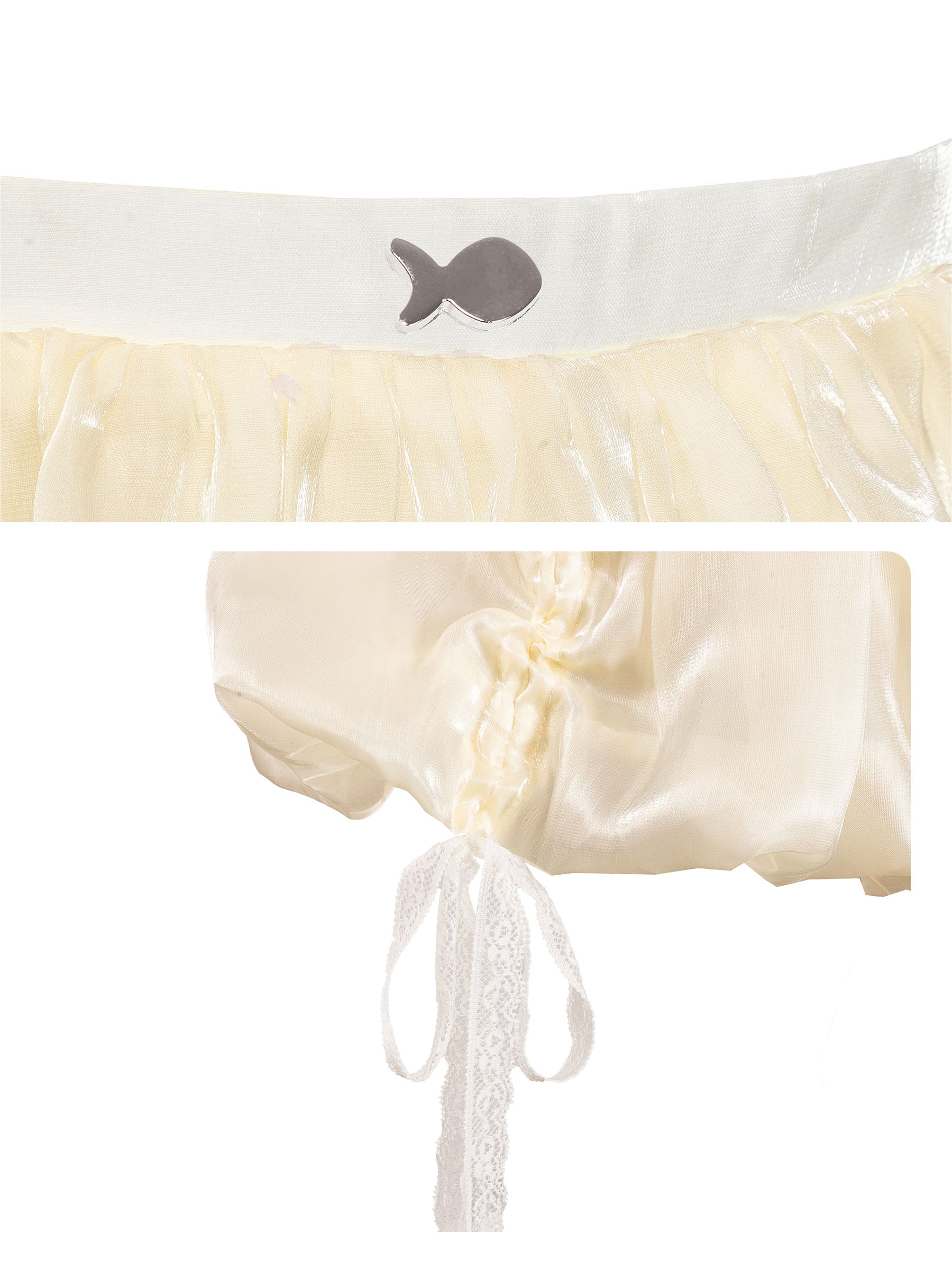 White headband with fish design and cream-colored fabric with lace trim on a white background