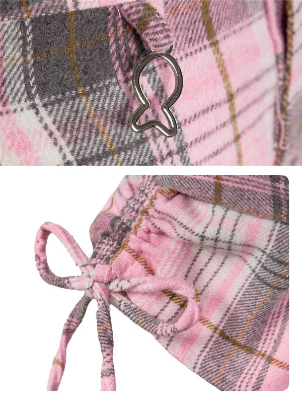 Close-up of a pink plaid drawstring bag with a metal clasp.