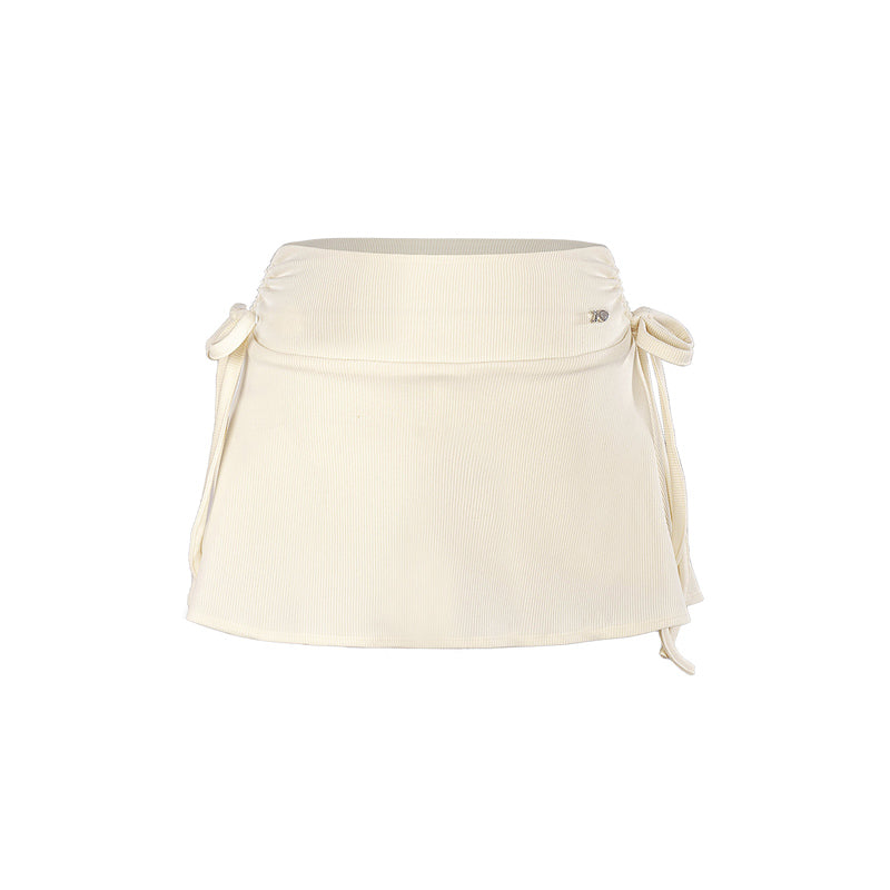 Beige waist bag with drawstring on a white background