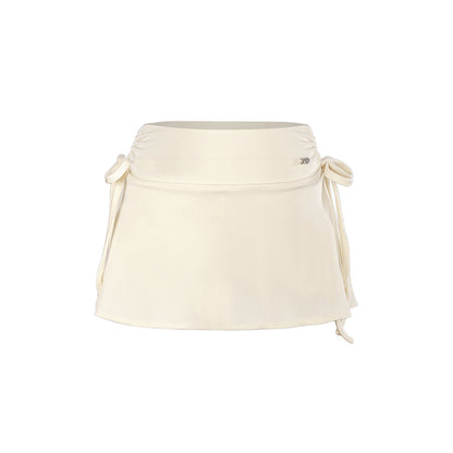 Beige waist bag with drawstring on a white background