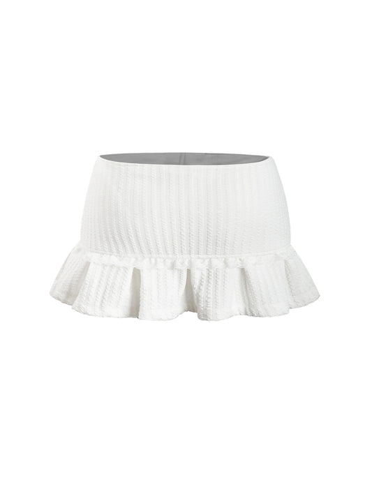 White skirt with ruffled hem on a white background