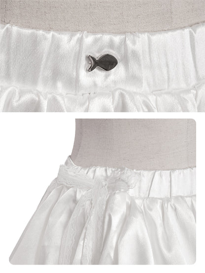 White ruffled petticoat with a button detail on a light gray background