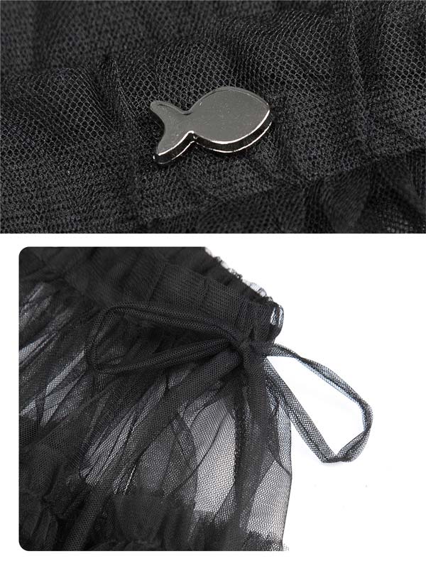 Black mesh bag with a fish-shaped metal clip on a textured black background.