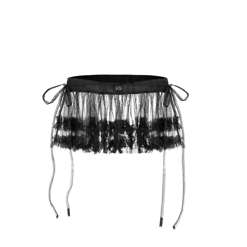 Black tulle skirt with sheer layers on a white background