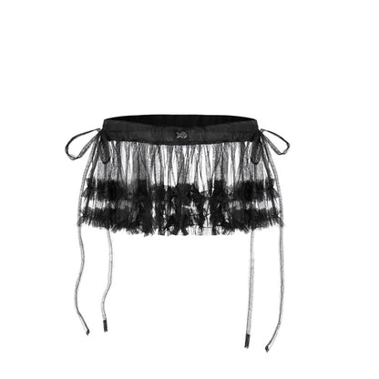 Black tulle skirt with sheer layers on a white background