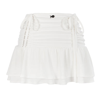 White off-shoulder top with ruffled details on a white background