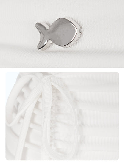 Silver fish-shaped object on a white background