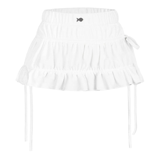 White ruffled top with a small black fish design on a white background