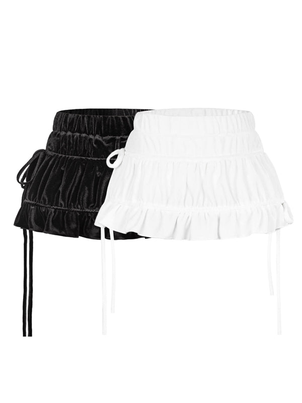 Black and white ruffled skirts on a white background