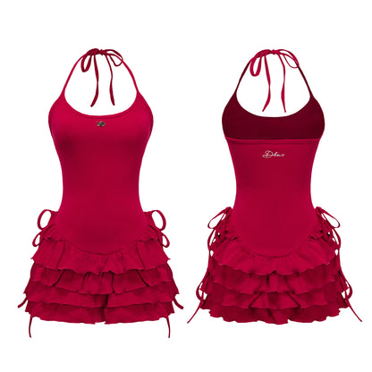 Red halter dress with ruffled layers on a white background