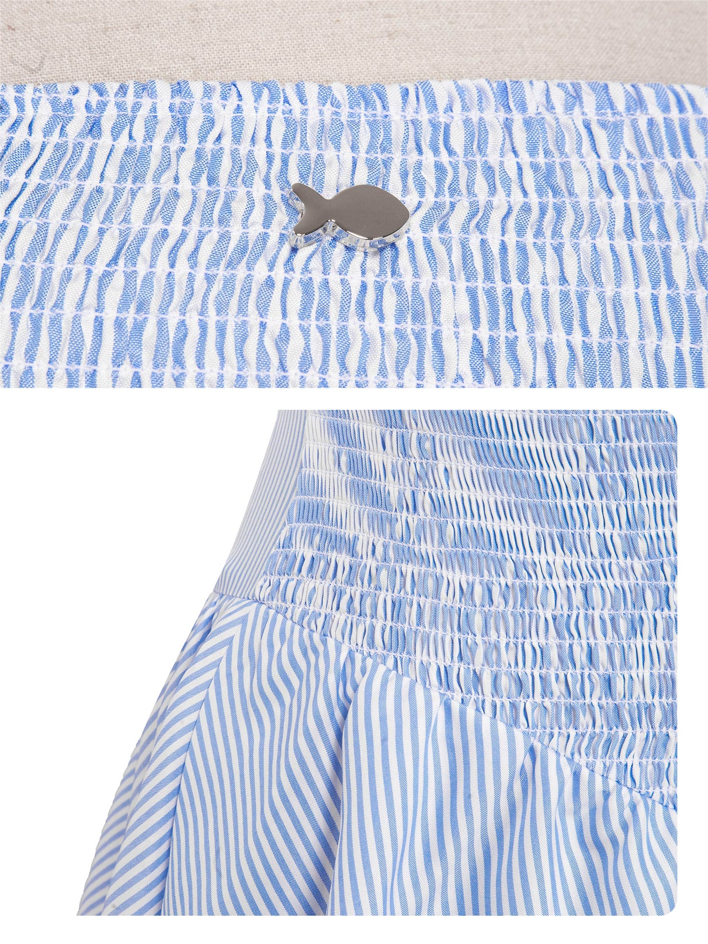 Blue and white striped dress with a patterned top on a light background