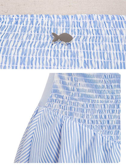 Blue and white striped dress with a patterned top on a light background