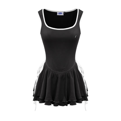 Black sleeveless dress with white trim on a white background